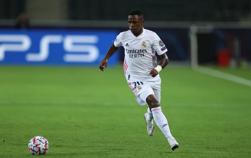 MOENCHENGLADBACH, GERMANY - OCTOBER 27: Vinicius Junior of Madrid runs with the ball during the UEFA Champions League Group B stage match between Borussia Moenchengladbach and Real Madrid at Borussia-Park on October 27, 2020 in Moenchengladbach, Germany. (Photo by Lars Baron/Getty Images)