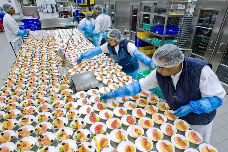 Staff at Emirates Flight Catering prepare dishes at their facilities in Dubai. Charles Crowell for The National