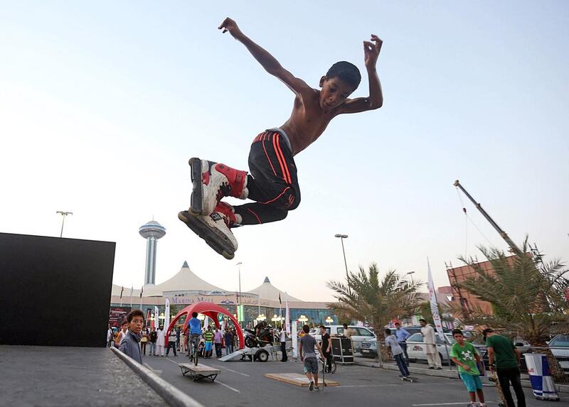 Ahmed Alaa, 14, uses a ramp at the Abu Dhabi International Show to perform a few tricks on his roler blades yesterday. Sammy Dallal / The National