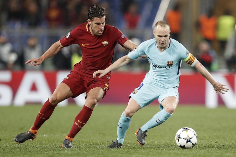 epa06660375 Roma's Kevin Strootman (L) and Barcelona's Andres Iniesta in action during the UEFA Champions League quarter final second leg match between AS Roma and FC Barcelona at Olimpico stadium in Rome, Italy, 10 April 2018.  EPA/RICCARDO ANTIMIANI