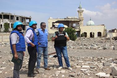 Abhijit Guha, second from left, chair of the UN's Redeployment Co-ordination Committee in Hodeidah city, and his team oversee the deployment of observers on frontlines in Hodeidah in October 2019. EPA