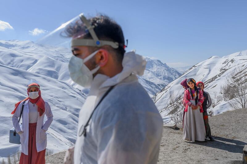 Doctor Sergen Saracoglu, centre, and nurse Yilzdiz Ayten are part of Turkey's drive to vaccinate members of its population of more than 83 million who live in remote areas. AFP