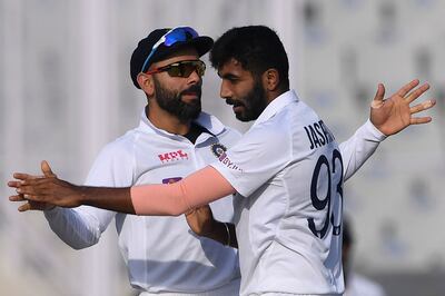 India's Jasprit Bumrah (R) celebrates the dismissal of Sri Lanka's Angelo Mathews with Virat Kohli. AFP
