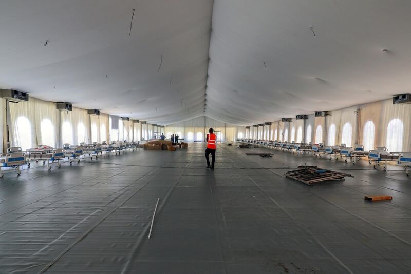 A man walks inside a new isolation and treatment centre at the Mobolaji Johnson Arena (formerly Onikan Stadium), erected as an additional measure to handle the outbreak of the coronavirus disease (COVID-19), in Lagos, Nigeria. REUTERS