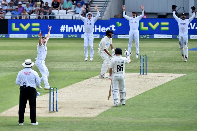 England bowler Matthew Potts, second left, unsuccessfully for the wicket of New Zealand's Daryl Mitchell. AP