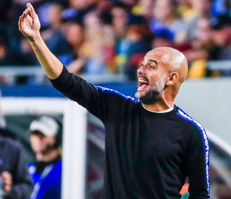 epa06901698 Manchester City coach Pep Guardiola shouts to his team in the first half of their International Champions Cup soccer match against Borussia Dortmund at Soldier Field in Chicago, Illinois, USA, 20 July 2018.  EPA/TANNEN MAURY