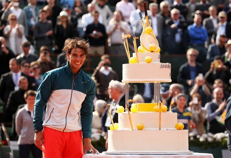 PARIS, FRANCE - JUNE 03:  Rafael Nadal of Spain is presented with a birthday cake after victory in his Men's Singles match against Kei Nishikori of Japan during day nine of the French Open at Roland Garros on June 3, 2013 in Paris, France.  (Photo by Matthew Stockman/Getty Images) *** Local Caption ***  169856081.jpg