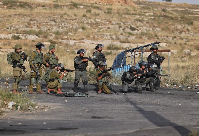 Israeli soldiers and border guards take up position during a Palestinian protest near Ramallah, in the occupied West Bank, on May 29. AFP