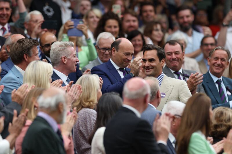 Roger Federer arrives at the Centre Court's Royal Box. AFP