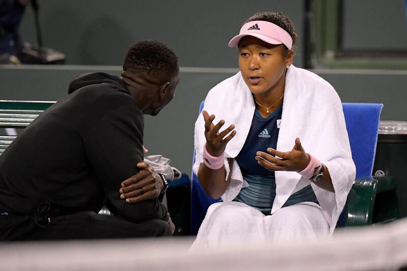 Naomi Osaka talks with her coach Jermaine Jenkins. AP Photo