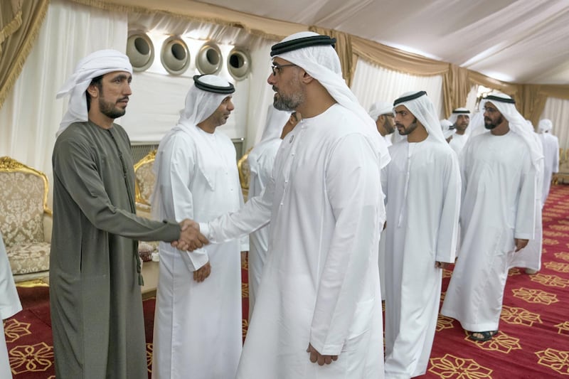 DIBBA, FUJAIRAH, UNITED ARAB EMIRATES - September 16, 2019: HH Major General Sheikh Khaled bin Mohamed bin Zayed Al Nahyan, Deputy National Security Adviser (L), offers condolences to the family of martyr Warrant Officer Ali Abdullah Ahmed Al Dhanhani. Seen with HH Sheikh Khalifa bin Tahnoon bin Mohamed Al Nahyan, Director of the Martyrs' Families' Affairs Office of the Abu Dhabi Crown Prince Court (2nd L) and HE Major General Abdullah Muhair Al Ketbi (3rd L)

(  Eissa Al Hammadi for The Ministry of Presidential Affairs )
---