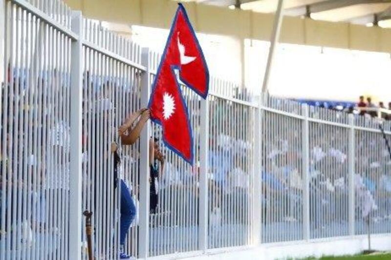 The Nepalese fans cheer on their team in Sharjah yesterday.