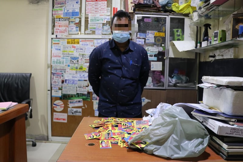 One of the four men accused of illegally printing massage cards. Photo: Abu Dhabi Police