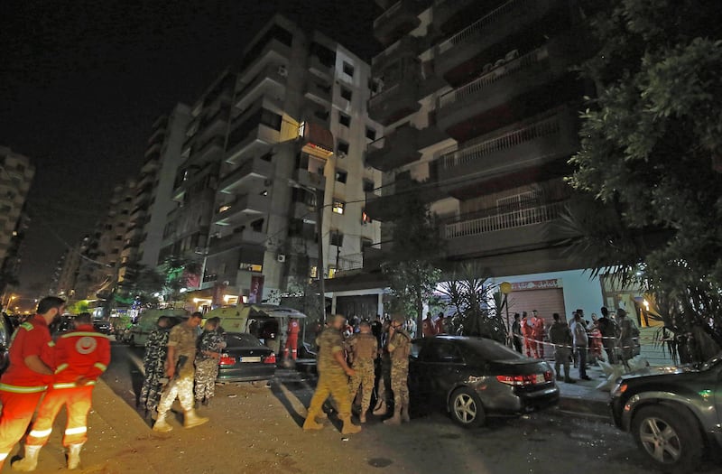 Lebanese security forces inspect the building where a militant attacked a security forces patrol and blew himself when confronted in the northern port city of Tripoli on June 4, 2019, on the eve of Eid el-Fitr. A militant attacked a patrol of Lebanon’s Internal Security Forces (ISF) in Tripoli on Monday night, killing two police officers and two army soldiers, state news agency NNA said. / AFP / Ibrahim CHALHOUB
