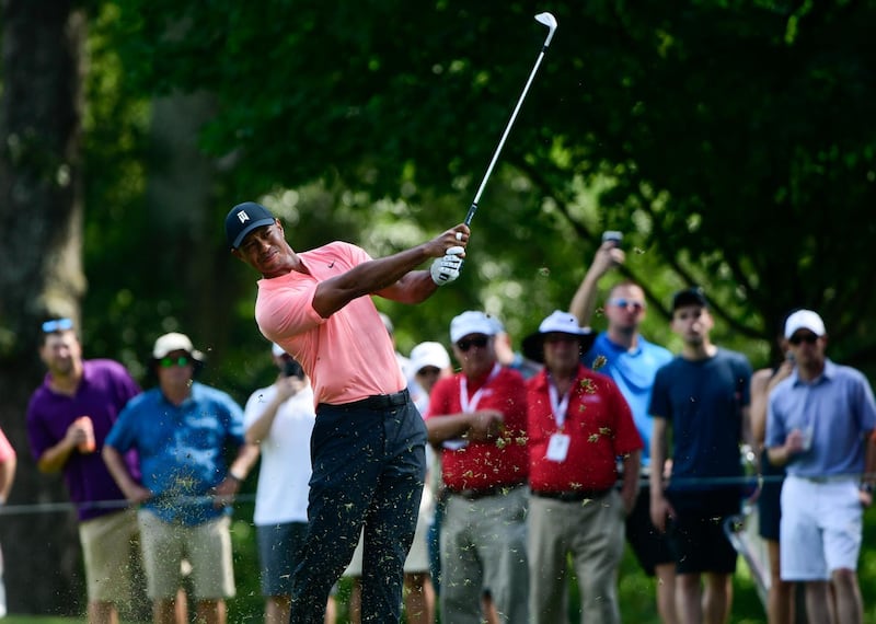 Tiger Woods hits on the fifth fairway during the first round of the Tour Championship golf tournament Thursday, Sept. 20, 2018, in Atlanta. (AP Photo/John Amis)