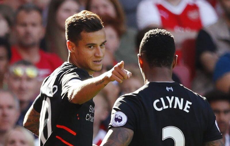 Liverpool’s Philippe Coutinho celebrates scoring their third goal with Nathaniel Clyne against Arsenal at the Emirates Stadium in London, Britain, 14 August 2016. Eddie Keogh / Reuters