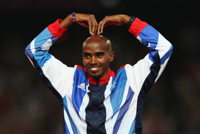 Farah shows off his famous 'Mobot' celebration on the podium after winning the gold medal in the men's 5,000m at the London 2012 Olympic Games. Getty Images