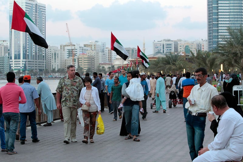 Sharjah, United Arab Emirates - December 2, 2014.  People of different nationalities strolling to celebrate the 43rd UAE National Day, at Al Majaz Corniche street.  ( Jeffrey E Biteng / The National )