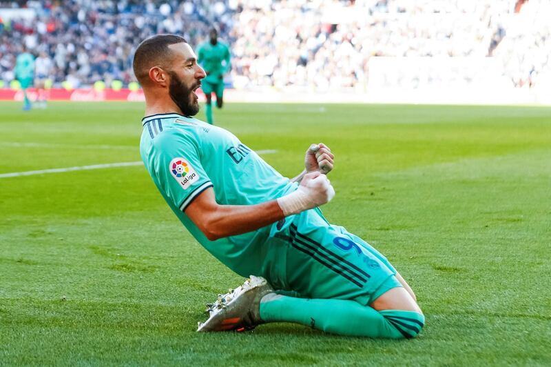 epa08051458 Real Madrid's Karim Benzema celebrates after scoring during the Spanish LaLaiga soccer match between Real Madrid and Espanyol at Santiago Bernabeu Stadium, in Madrid, Spain, 07 December 2019.  EPA/Emilio Naranjo