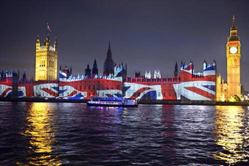 epa03358946 The Union Jack is projected on the House of Parliament on the eve of the last day of the London 2012 Olympic Games, London, Britain, 11 August 2012.  EPA/Rainer Jensen *** Local Caption ***  03358946.jpg
