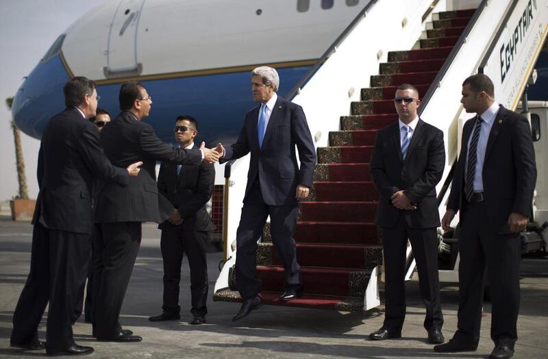 John Kerry disembarks from his plane in Cairo after arriving for talks with Egypt’s military-backed government.  Jason Reed / Reuters

