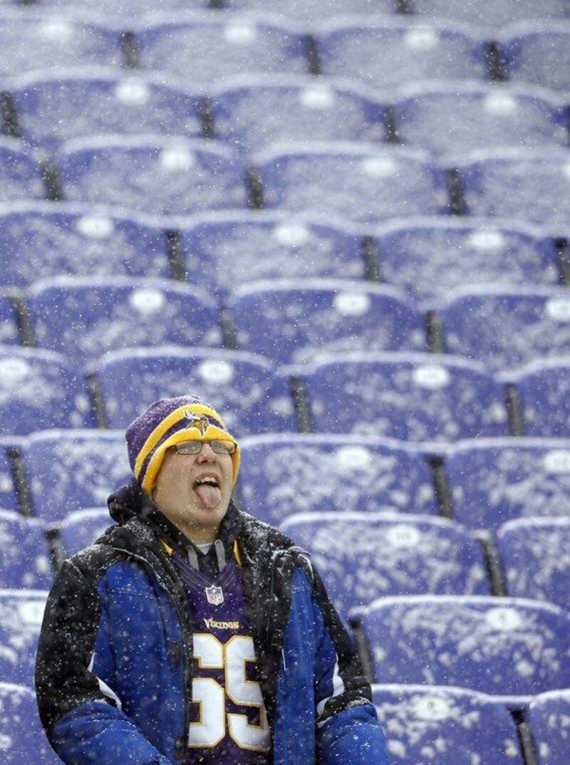 A Minnesota Vikings fan captures snowflakes on his tongue in Baltimore. Patrick Semansky / AP