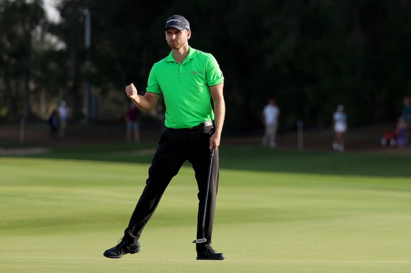 Daniel Gavins celebrates sinking his 30-foot putt to win the tournament on the 18th hole. Getty