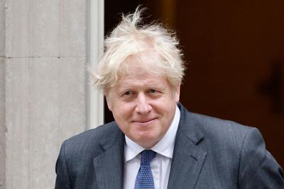 Britain's Prime Minister Boris Johnson prepares to greet Bahrain Crown Prince Salman bin Hamad bin Isa al-Khalifa outside 10 Downing street in central London on June 17, 2021. / AFP / Tolga Akmen
