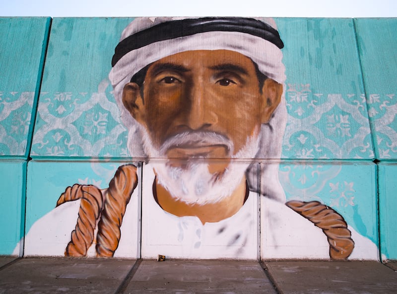A mural of an Emirati man by @UAE_Graffiti_Artist.