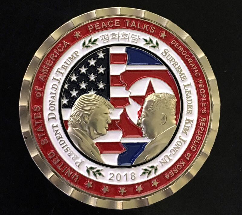 epa06760142 Front view of the US and North Korea Peace Talks commemorative 'Challenge Coin' celebrating the possible upcoming talks in Singapore between US President Donald J. Trump and North Korean leader Kim Jong-Un which were revealed 21 May at the White House in Washington, DC, USA, 24 May 2018.  US President Trump said on 24 May 2018, that the White House has cancelled a summit with North Korean leader Kim Jong-un scheduled for 12 June in Singapore.
The coins which for approximately fifteen years have been designed and released , as in this case, by the White House Communications Agency which is a US military unit that handles worldwide communications support to the US President and his staff.  EPA/STR
