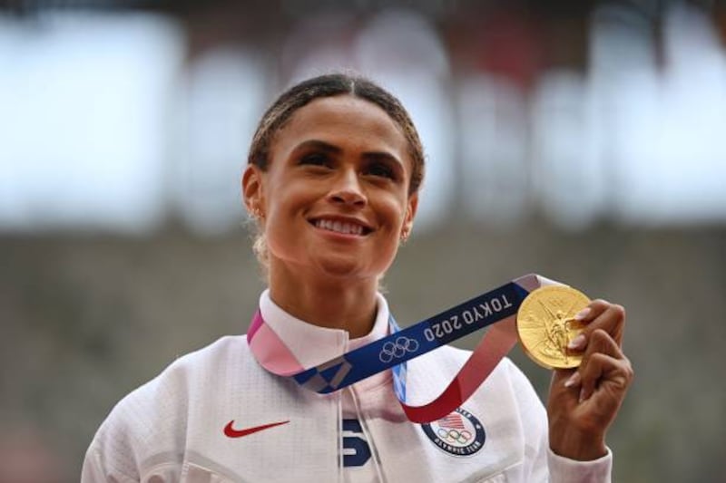 Gold medallist Sydney Mclaughlin on USA poses with her medal on the podium after the women's 400m hurdles event.