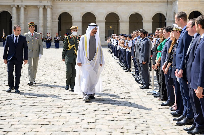 Sheikh Mohamed is accompanied by Mr Le Cornu as he inspects a guard of honour and meets officials at the military museum. Photo: Presidential Court