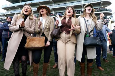 Racegoers react as they watch a race at the Cheltenham Festival on Thursday. PA