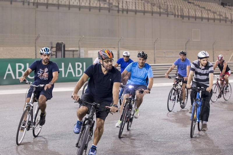 The Crown Prince of Abu Dhabi, and Sheikh Hamed bin Zayed Chairman of Crown Prince Court — Abu Dhabi and Executive Council Member, left, riding their bicycles around Yas Marina Circuit during the weekly TrainYAS event in October. Ryan Carter / Crown Prince Court — Abu Dhabi
