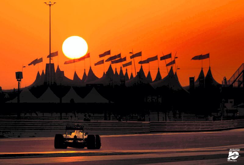 Looking for all the world like a scene from a David Lean blockbuster movie, silhouettes of Bedouin tents stand in front of a perfect bright yellow setting sun providing a stunning backdrop to the Mercedes of Lewis Hamilton as he races towards this wonderful vista during the 2013 Abu Dhabi Grand Prix.