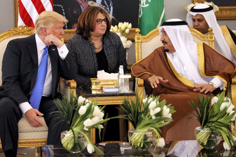 U.S. President Donald Trump, left, talks with Saudi King Salman after a welcome ceremony at the Royal Terminal of King Khalid International Airport, Saturday, May 20, 2017, in Riyadh. Trump opened his first trip abroad since taking office, touching down Saturday in Saudi Arabia for a visit aimed at building stronger partnerships to combat terrorism in the region and moving past the controversies engulfing his young administration. (AP Photo/Evan Vucci)