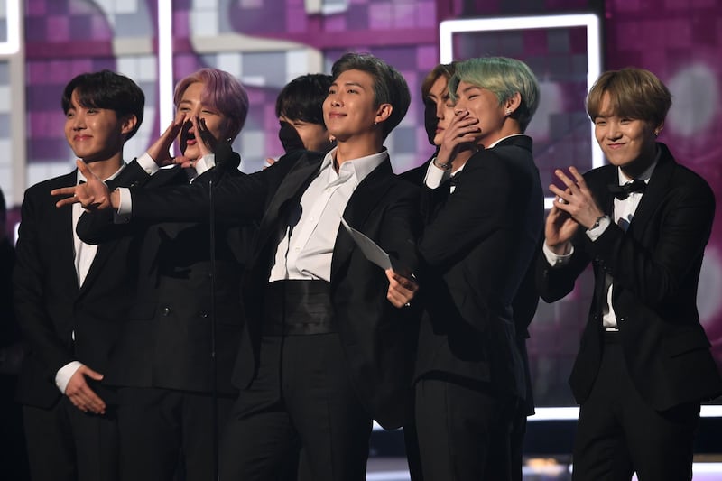 South Korean band BTS presents the award for Best R&B Album during the 61st Annual Grammy Awards on February 10, 2019, in Los Angeles.  / AFP / Robyn Beck
