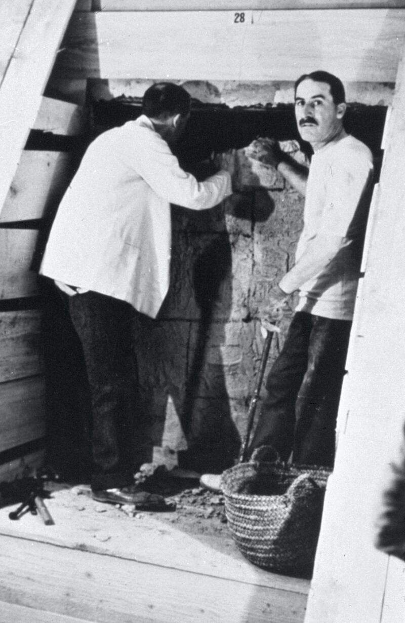 Howard Carter opening KV62, the tomb of the young pharaoh Tutankhamen in the Valley of the Kings, now renowned for the wealth of valuable antiquities it contained. The tomb was discovered in 1922 by Howard Carter. Tutankhamen was an Egyptian pharaoh of the 18th dynasty (ruled c. 1332-1323 BC). Now on display in the Cairo Museum. (Photo by: Universal History Archive/UIG via Getty Images)