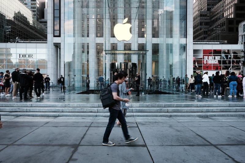 The Fifth Avenue Apple Store in New York City. In its 2019 redesign, the store gained a spiral steel-and-glass staircase, mirror-glass Skylenses and honey locust trees. Getty Images via AFP