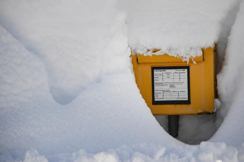 A letterbox is covered by heavy snow in Gerold. EPA