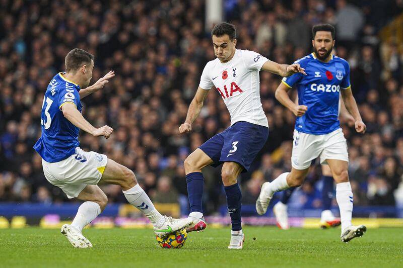 Everton full-back Seamus Coleman and Tottenham full-back Sergio Reguilon battle for the ball. PA