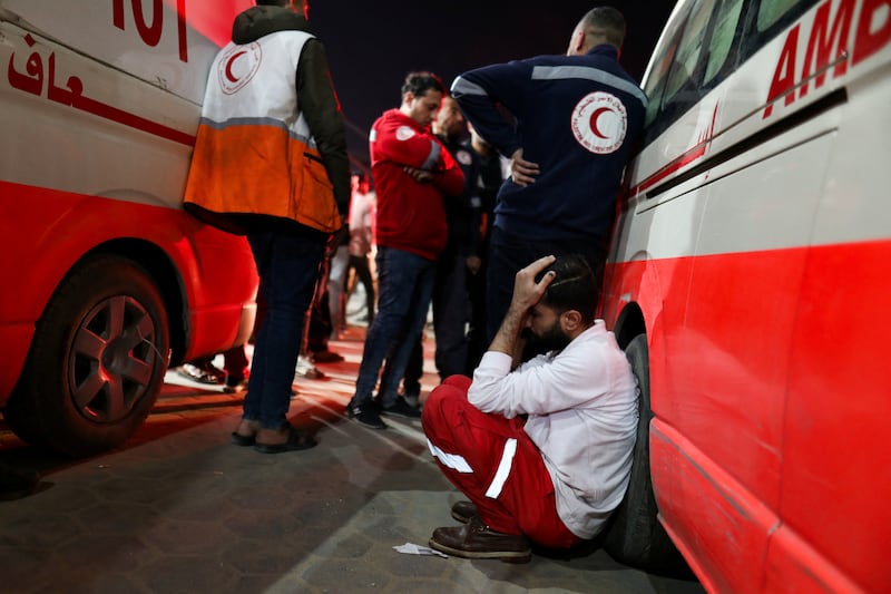 Palestinian medics mourn after members of the Palestinian Red Crescent were killed in an Israeli strike in Deir Al Balah. Reuters