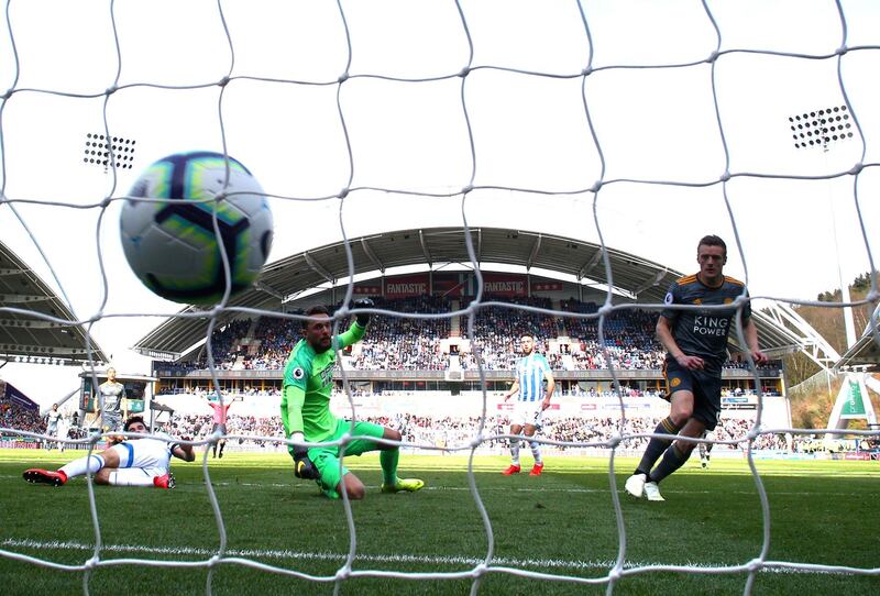 HUDDERSFIELD, ENGLAND - APRIL 06: Jamie Vardy of Leicester City scores his team's second goal past Ben Hamer of Huddersfield Town during the Premier League match between Huddersfield Town and Leicester City at John Smith's Stadium on April 06, 2019 in Huddersfield, United Kingdom. (Photo by Matthew Lewis/Getty Images)