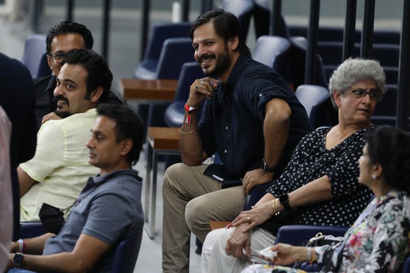 Actor Vivek Oberoi, centre, watches the match between Delhi Capitals and Sunrisers Hyderabad at the Dubai International Stadium on September 22, 2021. Sportzpics / IPL