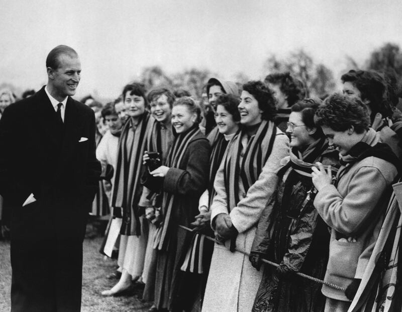 Britain's Prince Philip is greeted by some of the students of St Mary's College, in Cheltenham, England, as he left the playing fields of St Paul's College in 1957  AP Photo