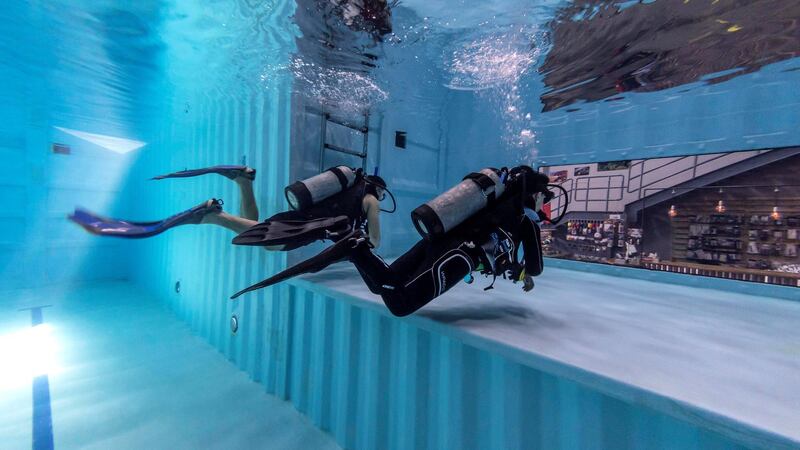 DUBAI, UNITED ARAB EMIRATES. 07 MARCH 2021.   Michela Colella, Dive Instructor, conducts a training session with a learner diver in the newly opened indoor pool at the Dive Garage facility in Al Quoz 4. The pool is constructed out of shipping containers and hols a 100 000 liters of fresh water, making it one of a kind in the Middle East. (Photo: Antonie Robertson/The National) Journalist: Janice Rodriques. Section: National.