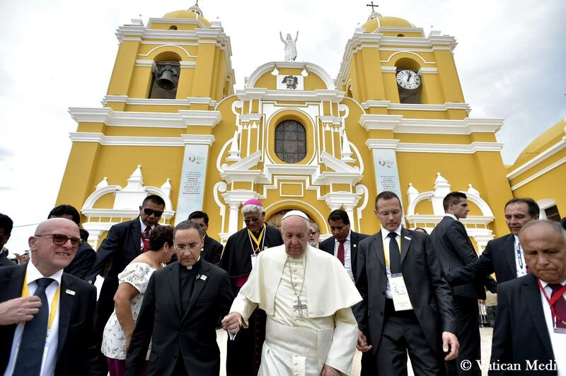 Pope Francis leaves the Plaza de Armas Cathedral, in Trujillo, Peru, Saturday, Jan. 20, 2018. Francis consoled Peruvians who lost their homes and livelihoods in devastating floods last year, telling them Saturday they can overcome all of life's "storms" by coming together as a community and stamping out the violence that plagues this part of the country. (L'Osservatore Romano/Pool Photo via AP)