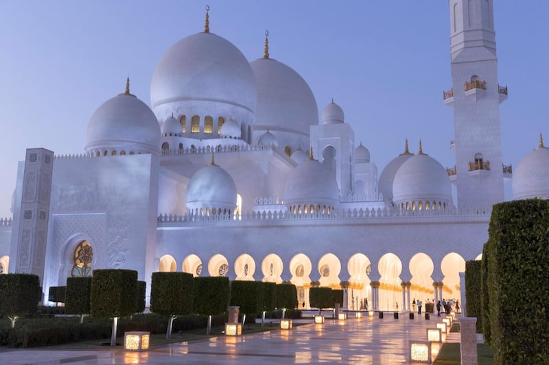 ABU DHABI, UNITED ARAB EMIRATES. 04 DECEMBER 2017. SHORTHAND piece on the anniversary of the Sheikh Zayed Grand Mosque in Abu Dhabi. Exterior view of the mosque at dusk / sunset. Constructed between 1996 to 2007 it was designed by Syrian architect Yousef Abdelky. The building complex measures approximately 290m by 420m and covers an area of more than 12 hectares. (Photo: Antonie Robertson/The National) Journalist: John Dennehy. Section: SHORTHAND.