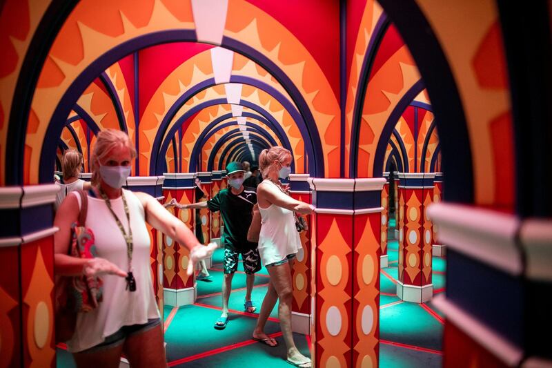 People walk through a house of mirrors attraction in Niagara Falls, Ontario, Canada. Reuters