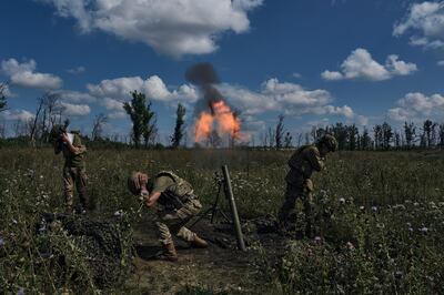 Ukrainian soldiers fire a mortar towards Russian positions at the front line, near Bakhmut. AP